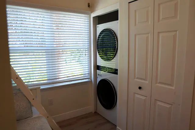 Washer and dryer stacked in the laundry closet at villa 5012