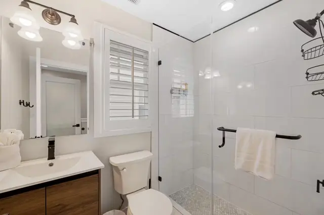 Bathroom at villa 5092 with a walk-in shower and a white vanity