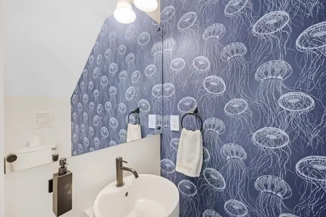Half bathroom at villa 5092 with jellyfish wallpaper