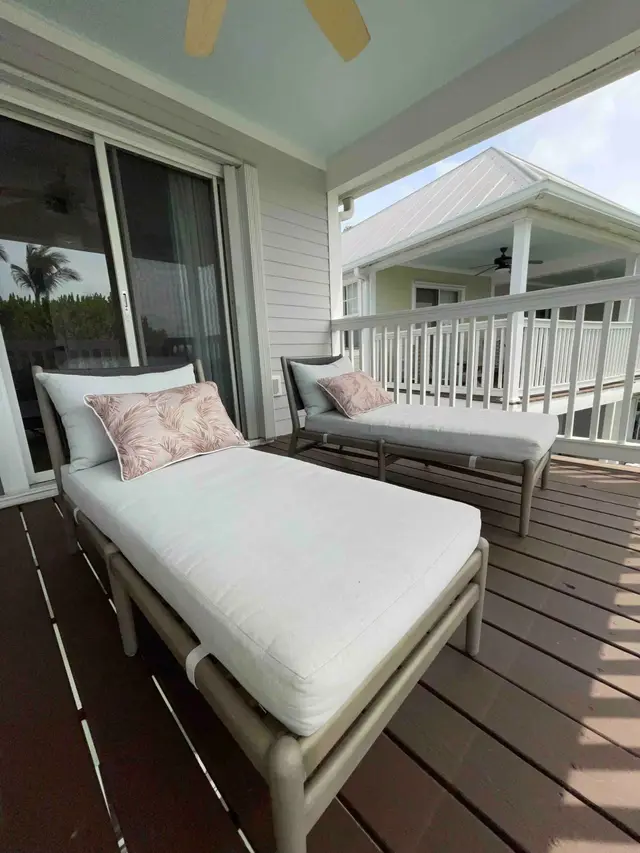 Bedroom at villa 5092 looking out to loungers on the balcony
