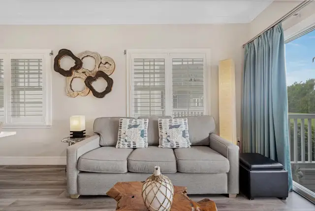 Sofa at villa 5092 beside shuttered windows